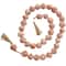 5ft. Paper Mache Round Distressed Beaded Garland with Tassel